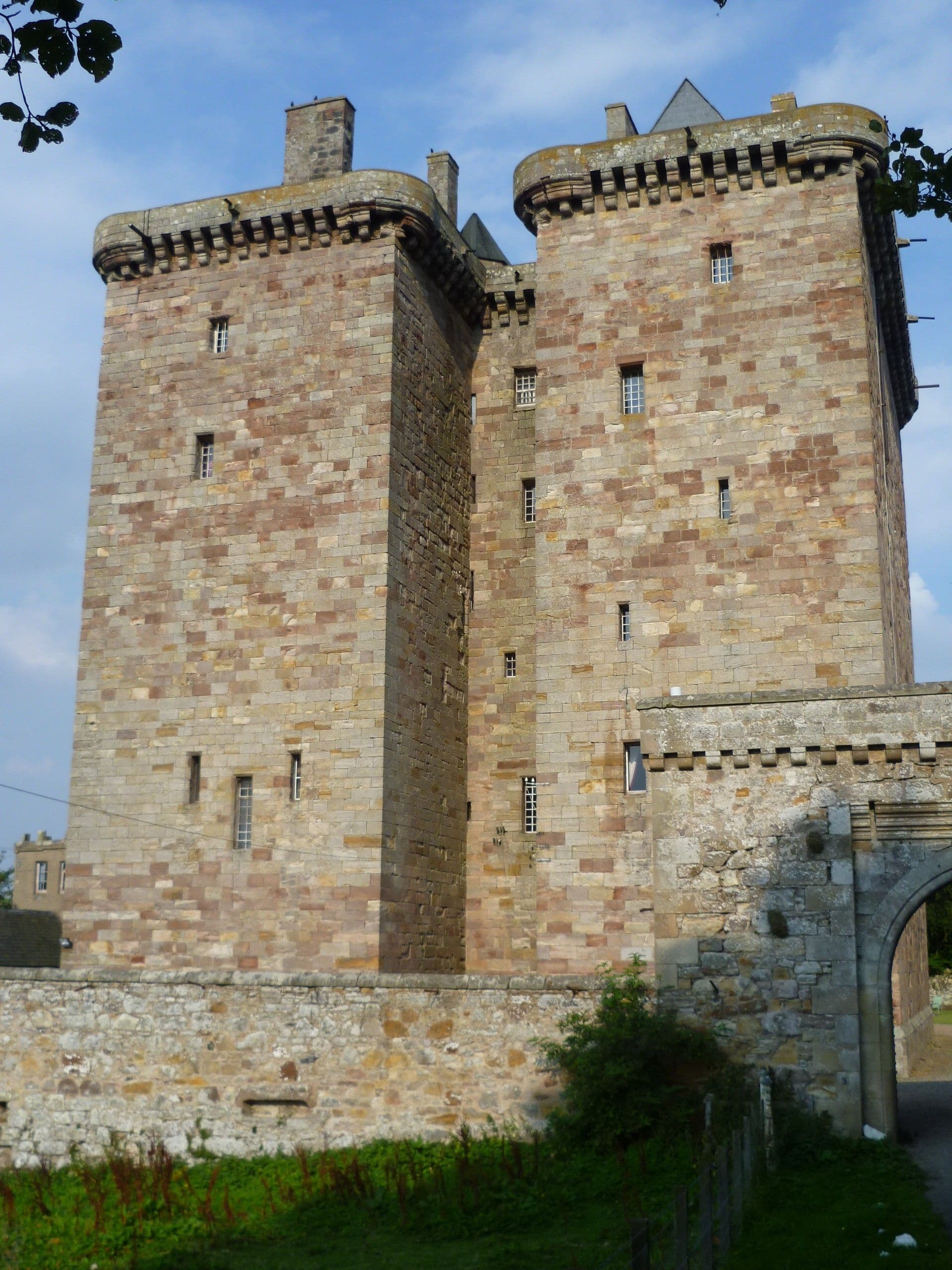 The fortified tower house was the classic Scottish solution to the problem of building defensible structures in a country where warfare was endemic for centuries. The Scottish Lowland landscape is peppered with many fine examples, to the extent that the 16thC historian, John Major, could write,
"There are in Scotland for the most part two strongholds to every league, intended both as a defence against a foreign foe, and to meet the first outbreak of a civil war." (History of Greater Britain, 1521).
Scotland's Stewart monarchs explicitly forbade the Scottish nobility to imitate the fortifications of their royal castles. Most 'castles' in Scotland are in fact tower houses which have been expanded by additional ranges which can often conceal the original tower at first sight. Borthwick is a unique example of twin towers.