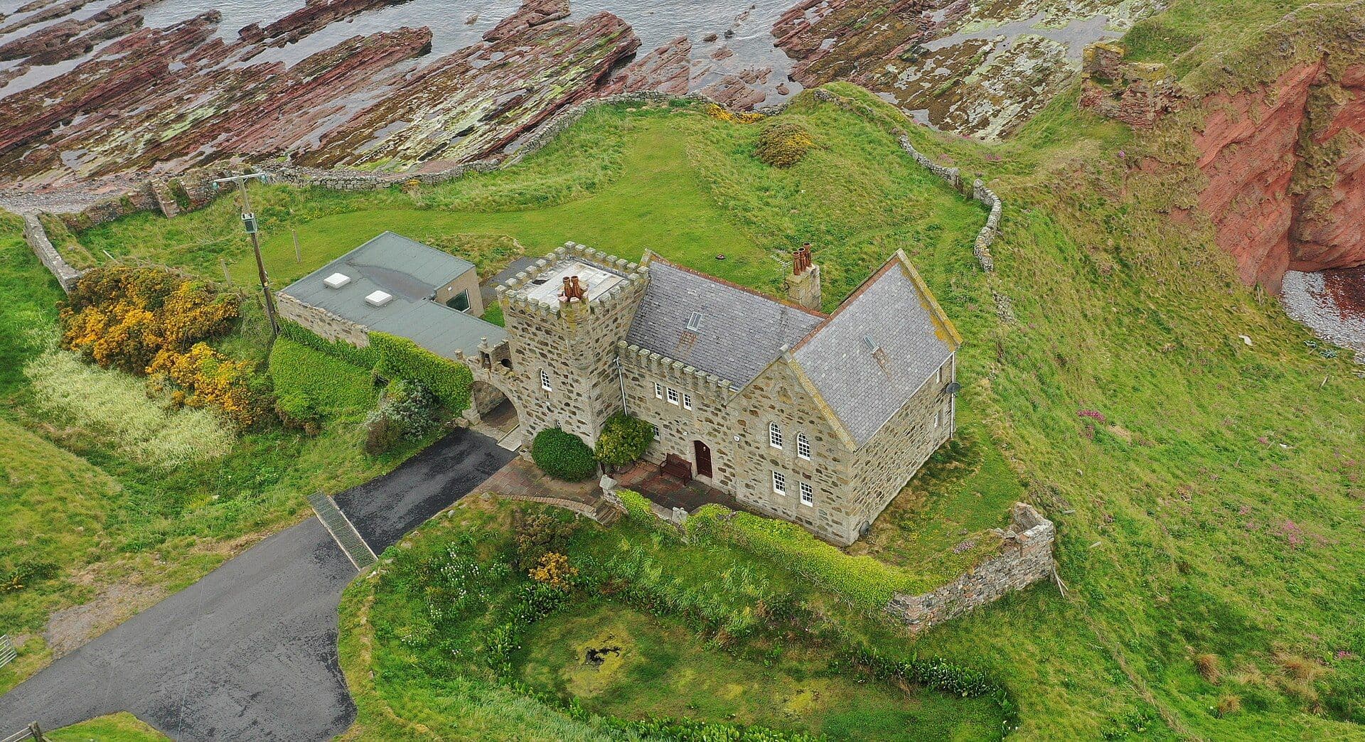 Dundarg Castle, Aberdeenshire — No part of the current building is older than 100 years, however the entrance arch stands where the medieval castle gatehouse stood. Rather