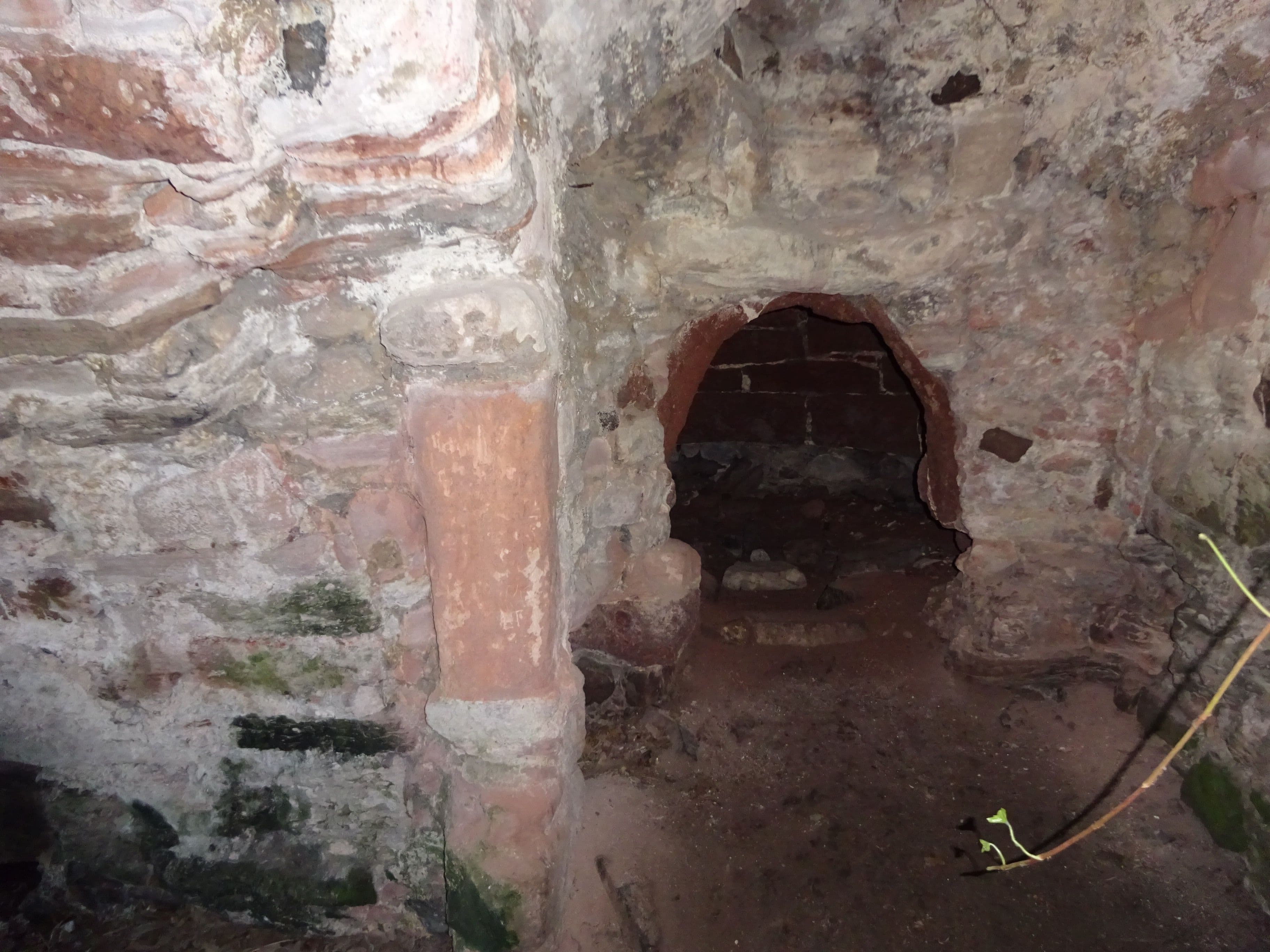 Auldhame Castle, East Lothian, Scotland, bread oven in kitchen. The vertical red stone is a jamb of the main kitchen fireplace.