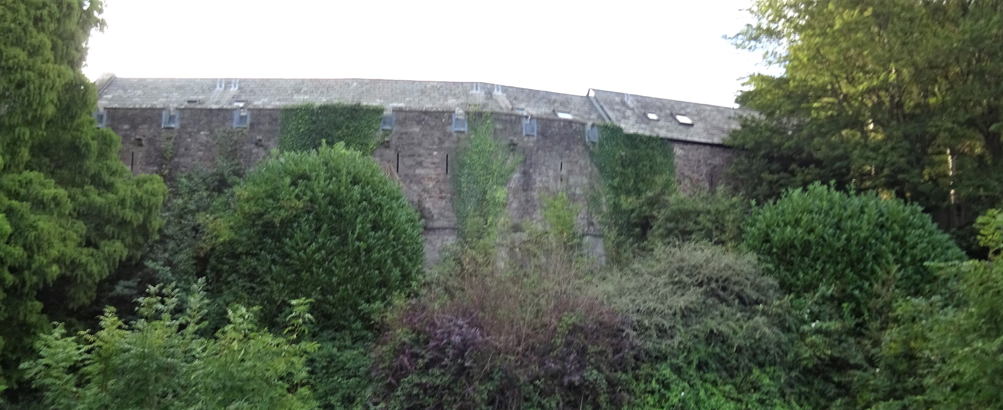 The Brecon Castle walls, Brecon. View from nearby car park. Wales.