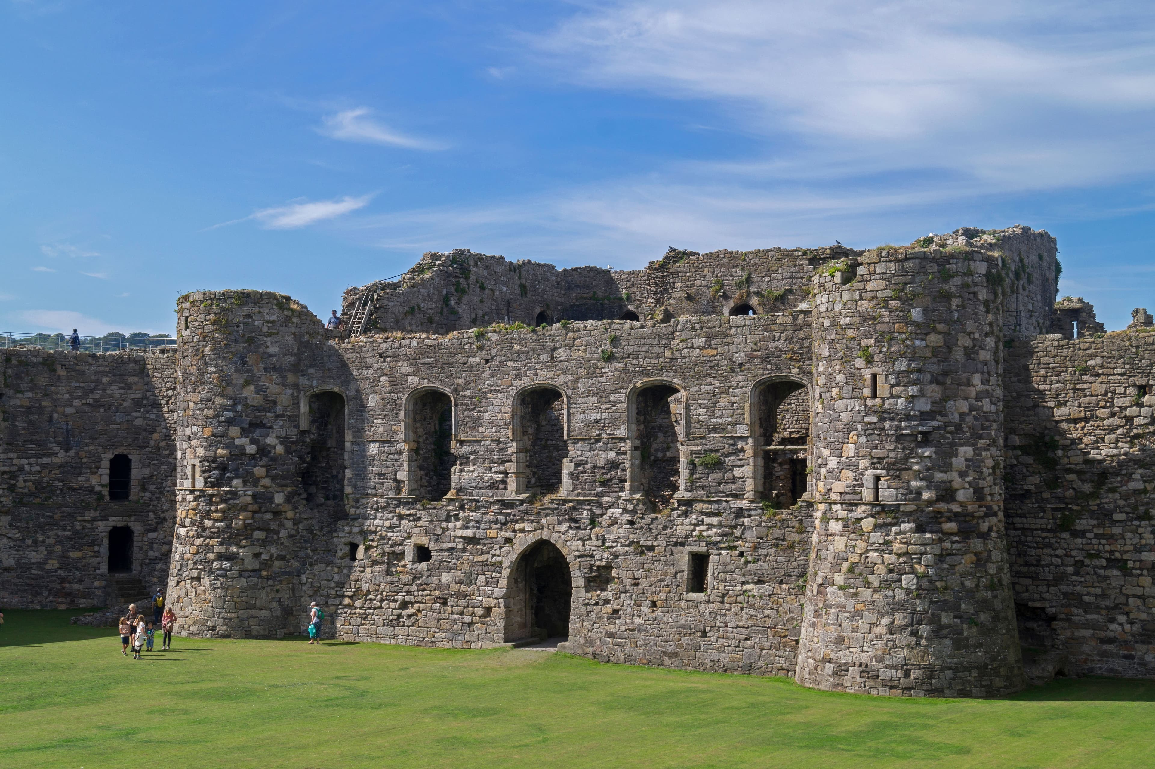 The North Gatehouse of Beaumaris Castle in Anglesey, Wales. This castle, one of those constructed by King Edward I to defend his newly-conquered territories in the north-west of Wales, was left incomplete when work finished in 1330, but was still one of the largest and most expensive structures ever built at that time. The depicted gatehouse was originally intended to extend nearly to twice its current height, and was modelled under the similar gatehouse at Harlech.